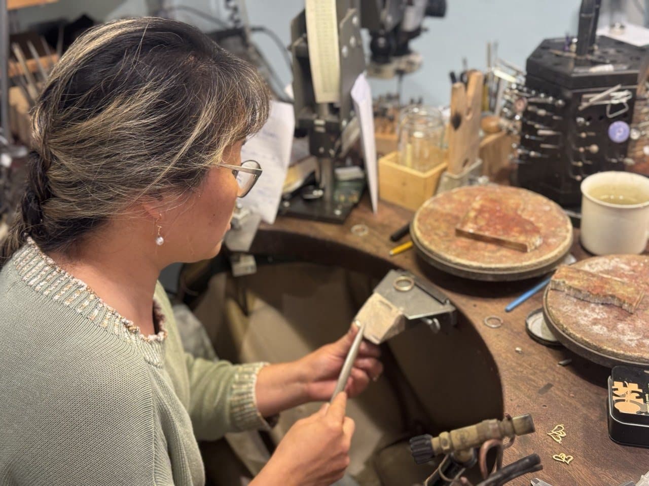 Rebecca Falck polishing a ring at the goldsmith's bench